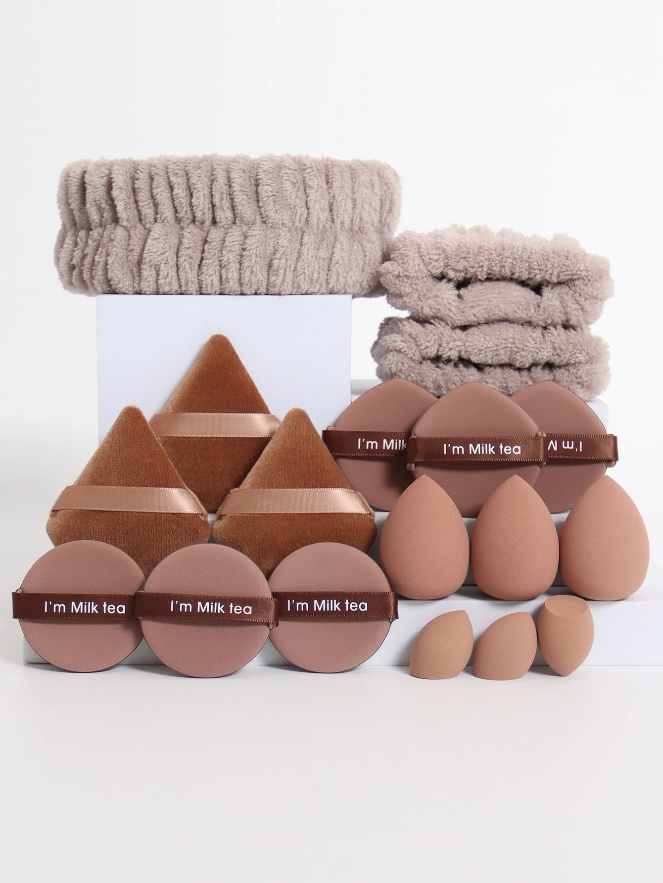 18 Piece Headband Set. 1 Hair Band & 2 Wrist Bands & 3 Make-Up Sponges & 3 Mini Square Air Cushions & 3 Triangular Powder Puff &
