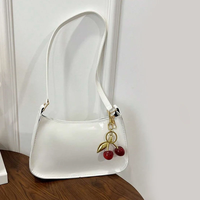 Women's PU Leather Handbag Versatile Fashion Solid Color Cherry Pendant Shoulder Bag Casual Commuting Bag Underarm Bag