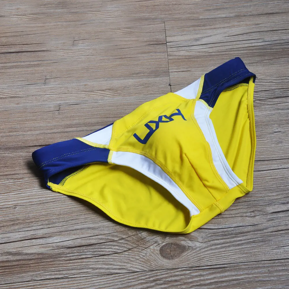 2026 warehouse real shot men's fashion stitching briefs Japanese show beach swimming trunks close-fitting briefs UXH026