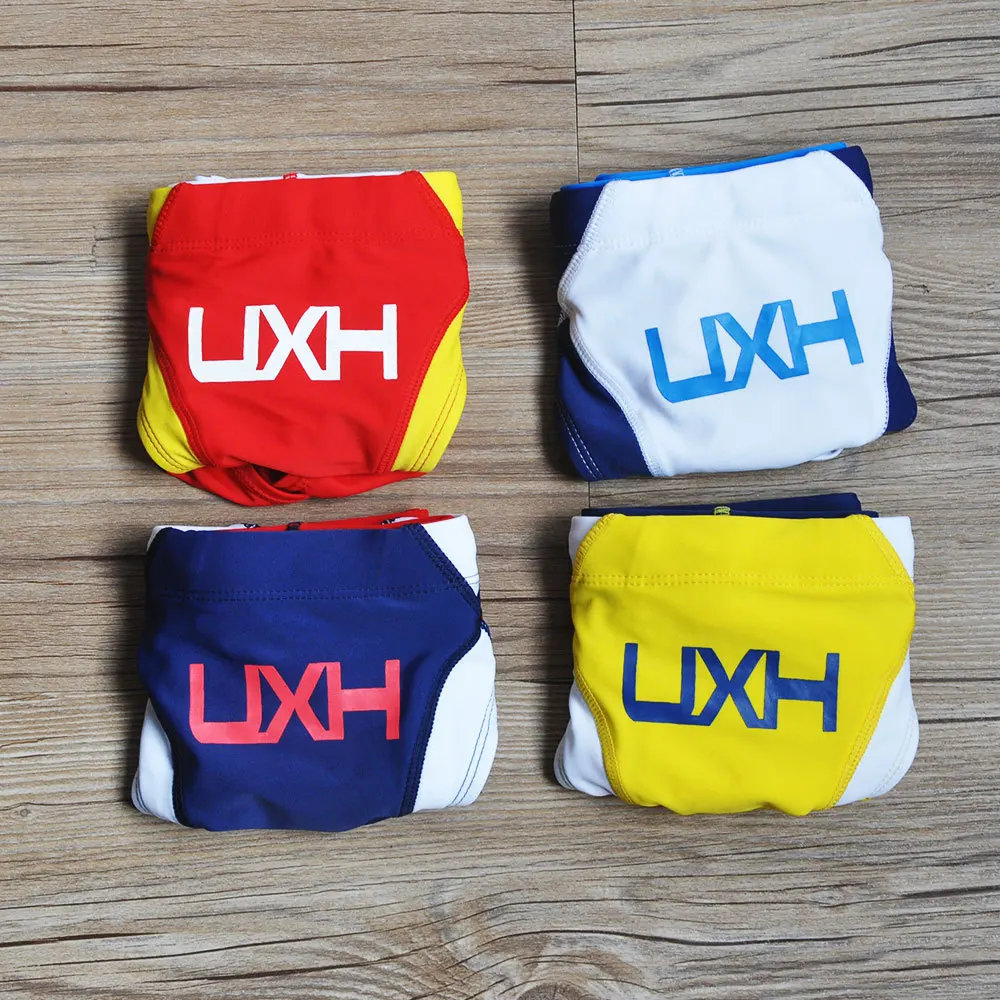 2026 warehouse real shot men's fashion stitching briefs Japanese show beach swimming trunks close-fitting briefs UXH026