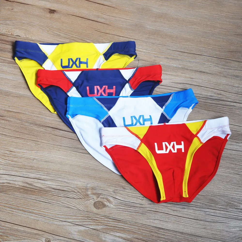 2026 warehouse real shot men's fashion stitching briefs Japanese show beach swimming trunks close-fitting briefs UXH026