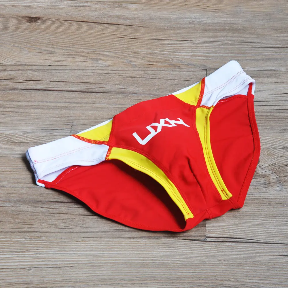 2026 warehouse real shot men's fashion stitching briefs Japanese show beach swimming trunks close-fitting briefs UXH026
