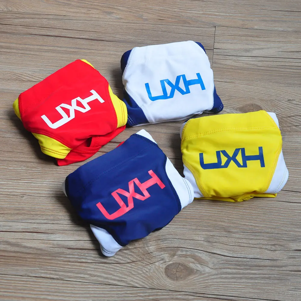 2026 warehouse real shot men's fashion stitching briefs Japanese show beach swimming trunks close-fitting briefs UXH026