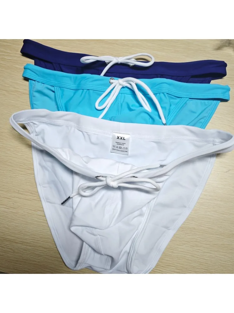 2026 New's slender waist men's swimming trunks foreign trade triangle swimsuit European and American new fashion D101