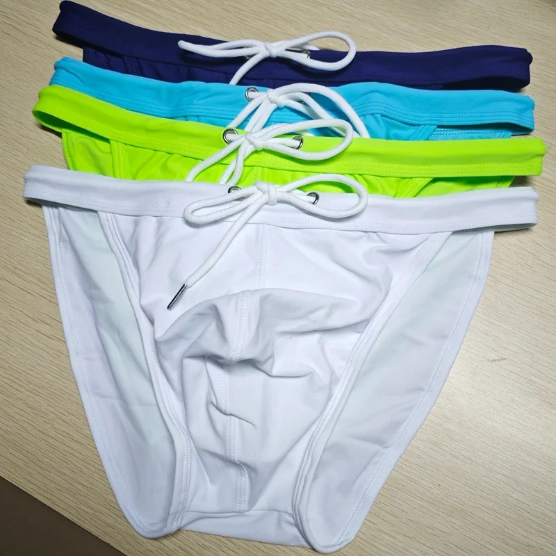 2026 New's slender waist men's swimming trunks foreign trade triangle swimsuit European and American new fashion D101