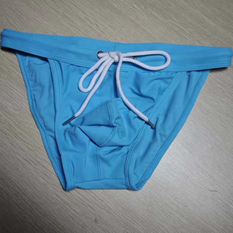 2026 New's slender waist men's swimming trunks foreign trade triangle swimsuit European and American new fashion D101