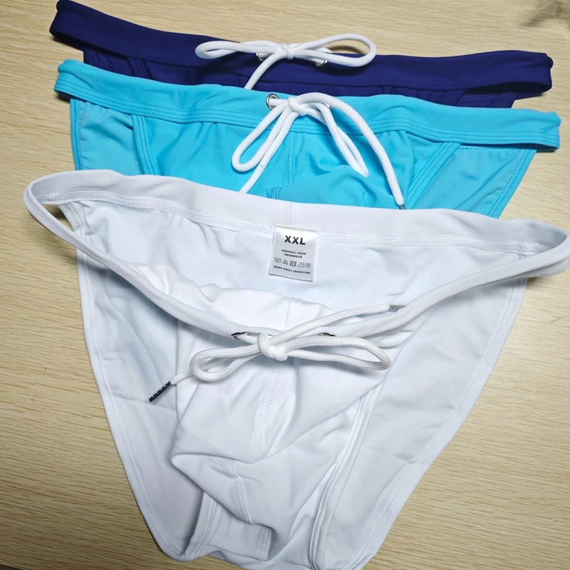 2026 New's slender waist men's swimming trunks foreign trade triangle swimsuit European and American new fashion D101