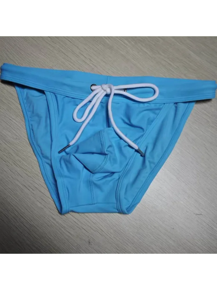 2026 New's slender waist men's swimming trunks foreign trade triangle swimsuit European and American new fashion D101
