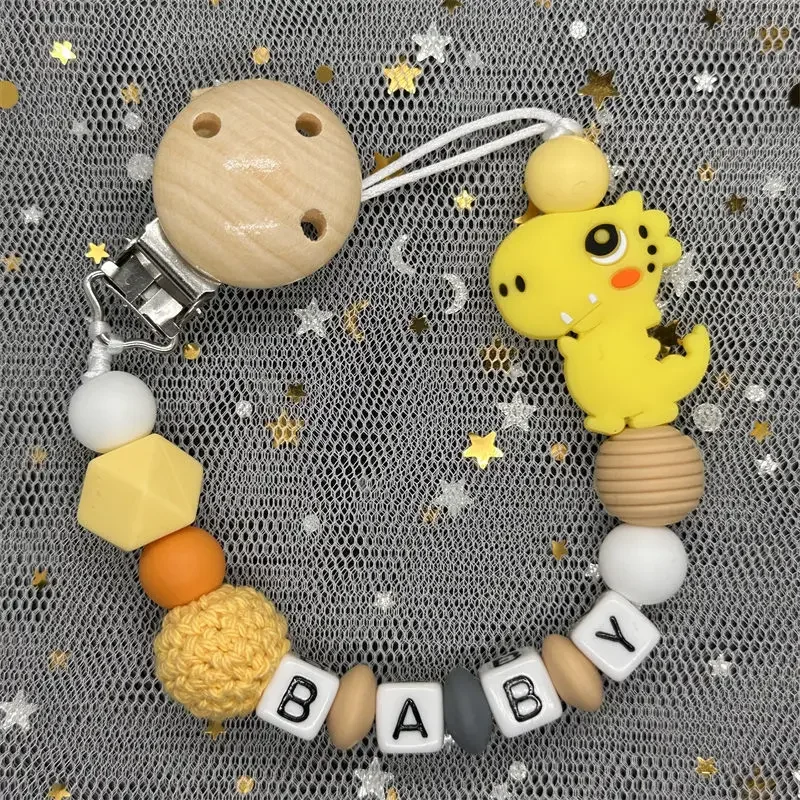 Hot Sale Custom Personalized Name Handmade Pacifier Clip Holder Silicone Dinosaur Pacifier Chain Baby Teether Teether Chain Gift