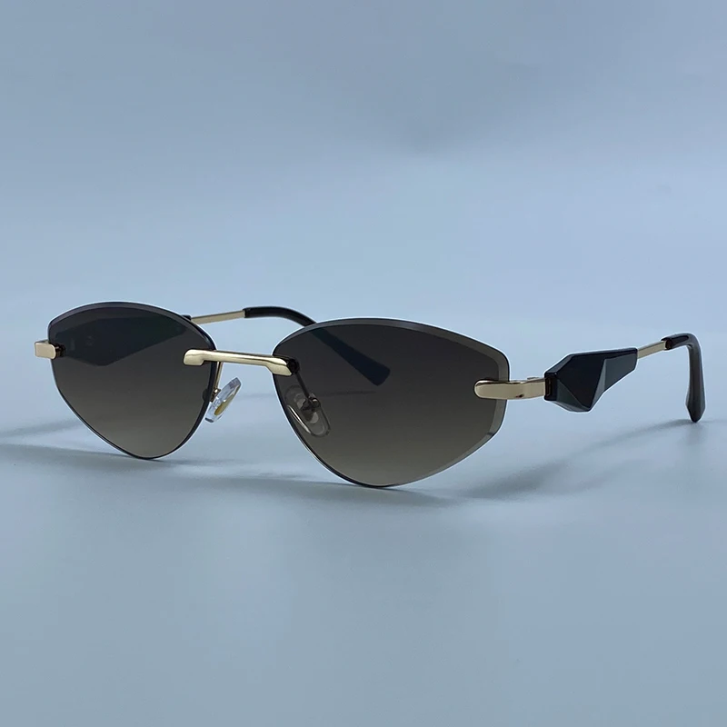 Sexy Cat Eye Rimless Punk Sunglasses Women New 2026 Luxury Designer Trendy Frameless Polygon Sun Glasses Vintage Metal Shades