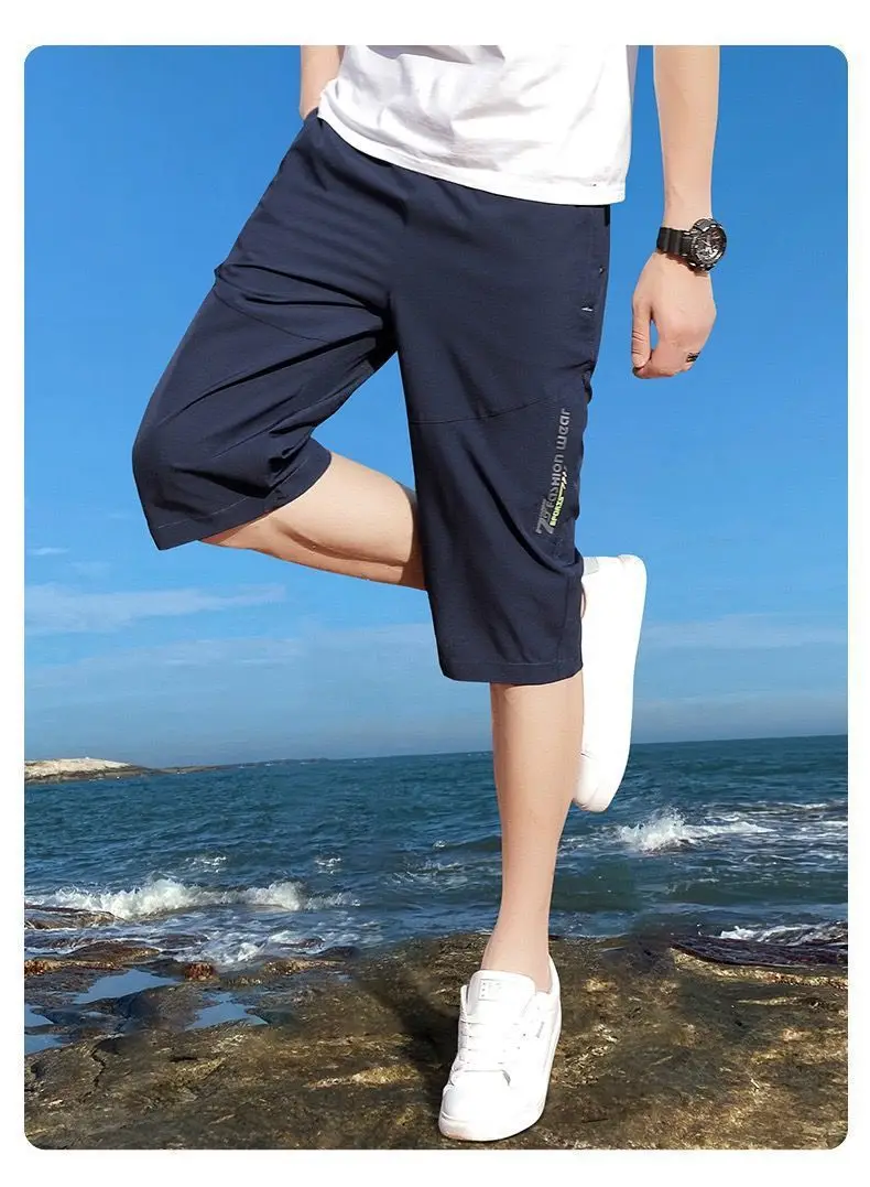 2025 New Men's Seven point Ice Silk Zipper Pocket Casual Pants Breathable Elastic Fabric Slimming Version Summer Outdoor Vacatio