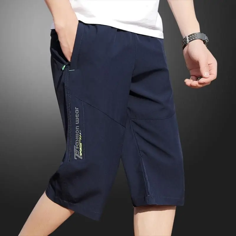 2025 New Men's Seven point Ice Silk Zipper Pocket Casual Pants Breathable Elastic Fabric Slimming Version Summer Outdoor Vacatio