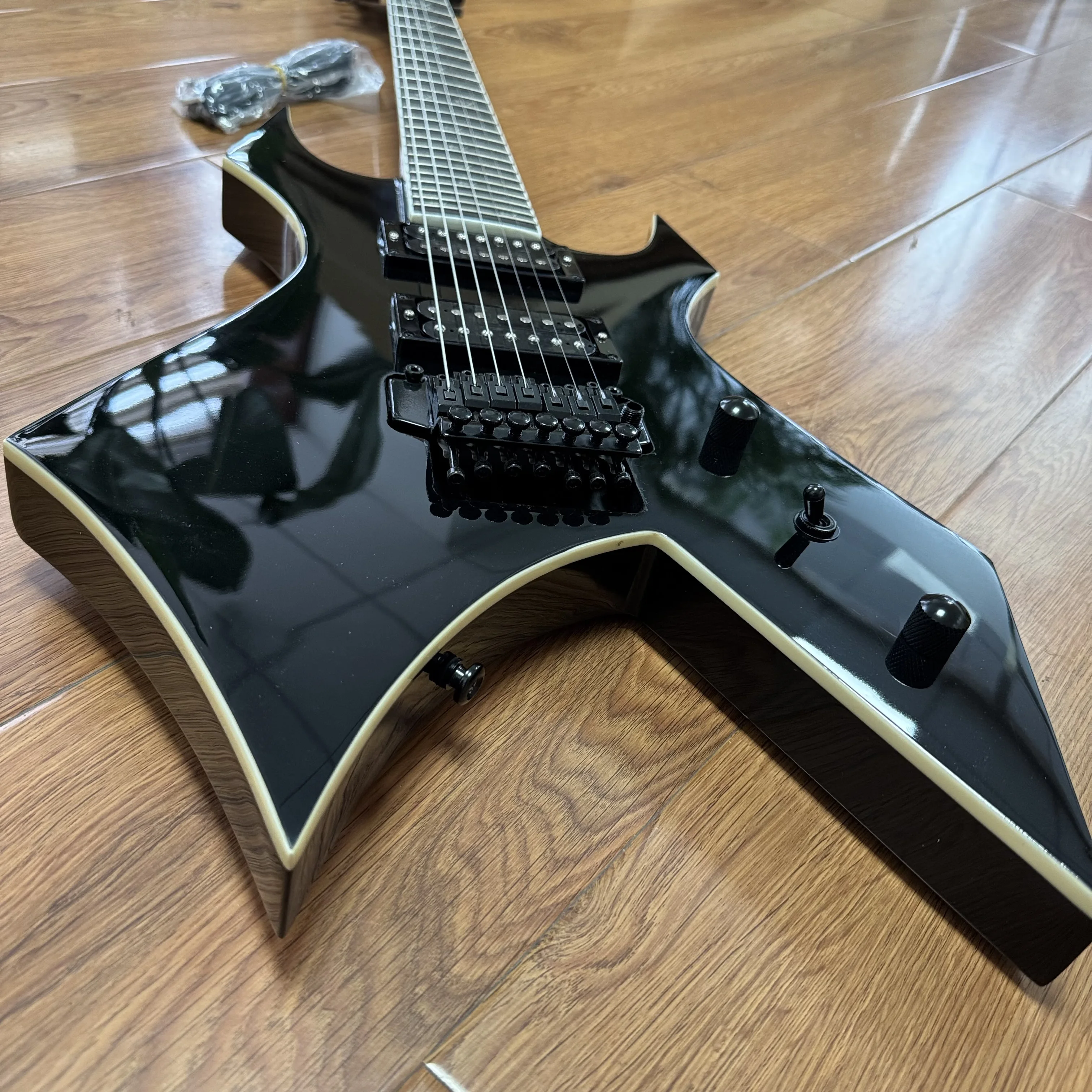 7-String Electric Guitar with Shiny Black High-Gloss Finish and Dual Coil Pickups. Heavy Metal Style. Classic Guitar Shape. Black Fretboard. Embedded Special Pattern Frets. US Warehouse Stock. Free Shipping.