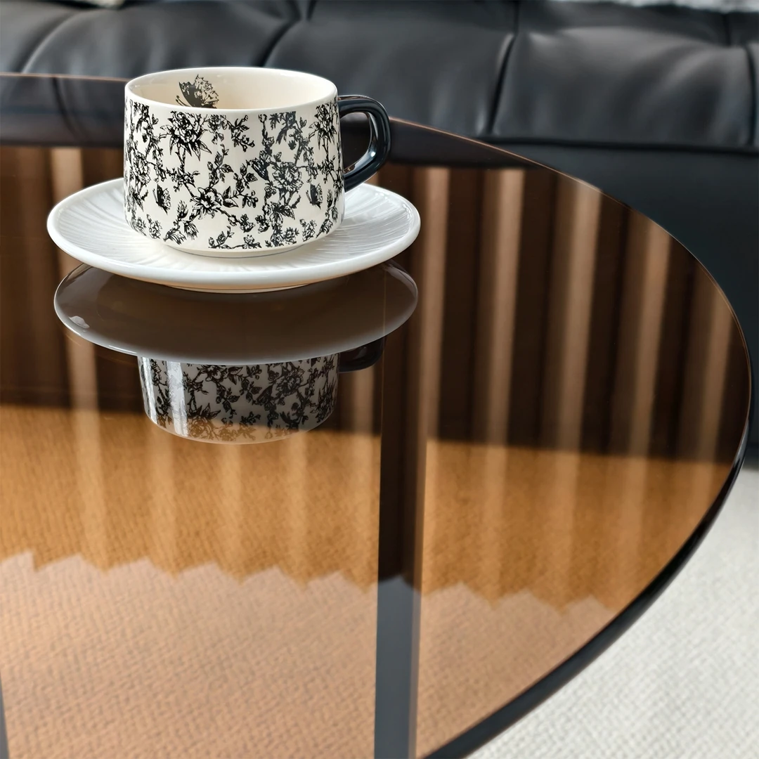 Round Amber-Tinted Tempered Glass Coffee Table Cocktail Center Table with Sintered Stone Storage Tier & Black Metal Frame