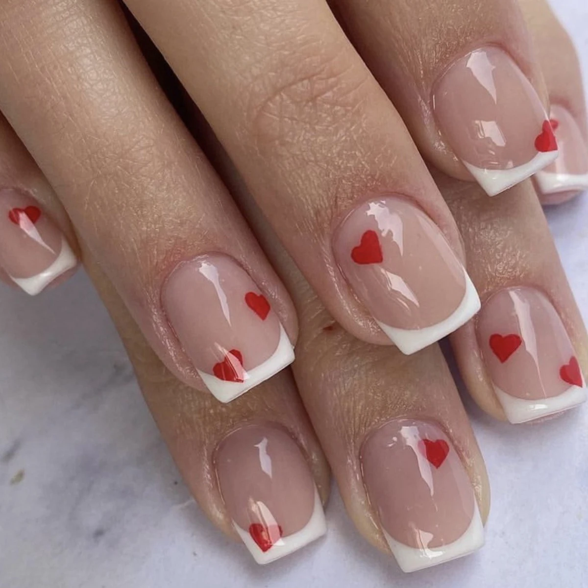 24 pieces of short square fake nails, featuring a halo dyed gradient heart and a colorful French design in European and American