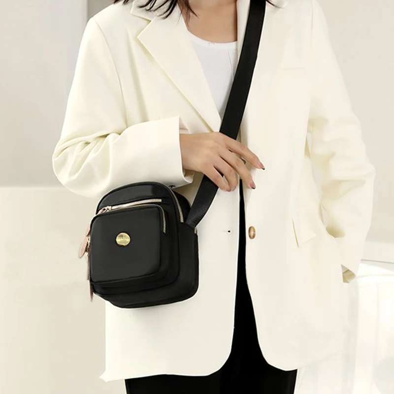 Neutral style compact mini bags for men and women, designed for travel and outings, featuring a simple single-shoulder design.