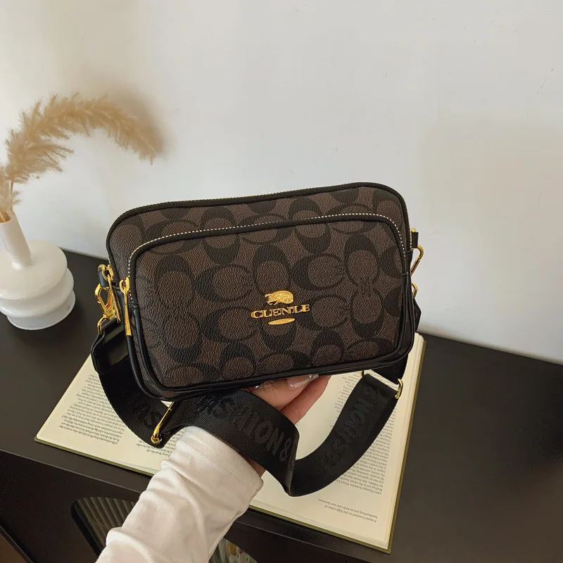 Original Circular-Pattern Logo Crossbody: Retro-luxury, durable fabric, adjustable strap. Ideal for daily/work/social use