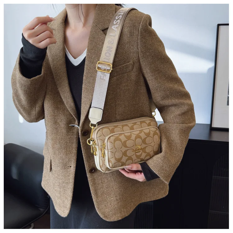 Original Circular-Pattern Logo Crossbody: Retro-luxury, durable fabric, adjustable strap. Ideal for daily/work/social use