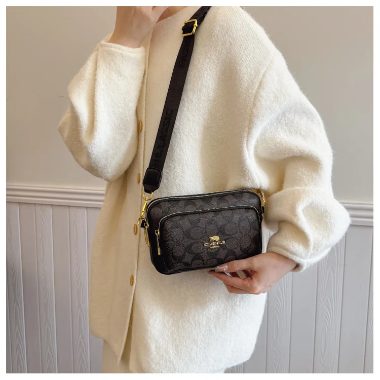 Original Circular-Pattern Logo Crossbody: Retro-luxury, durable fabric, adjustable strap. Ideal for daily/work/social use