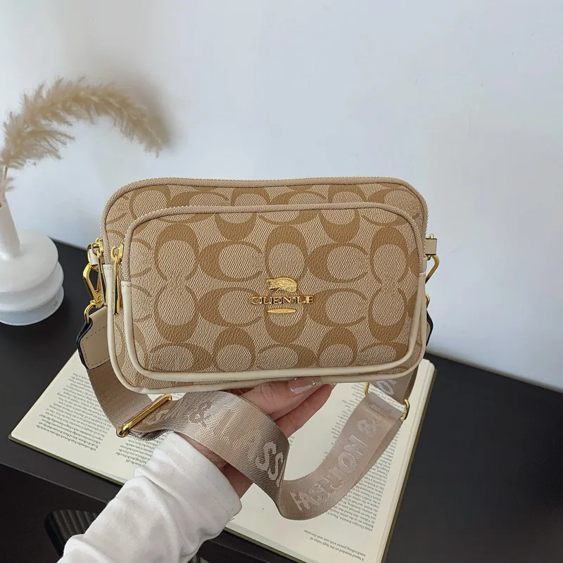 Original Circular-Pattern Logo Crossbody: Retro-luxury, durable fabric, adjustable strap. Ideal for daily/work/social use