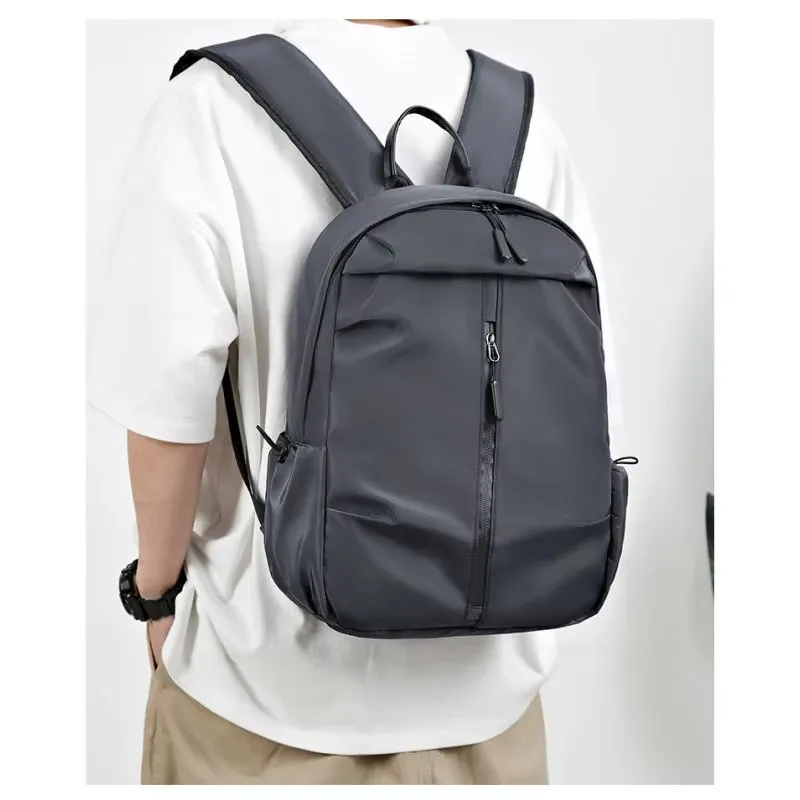 Men's water-resistant backpack with spacious compartments, perfect for laptops, travel, business, and student use