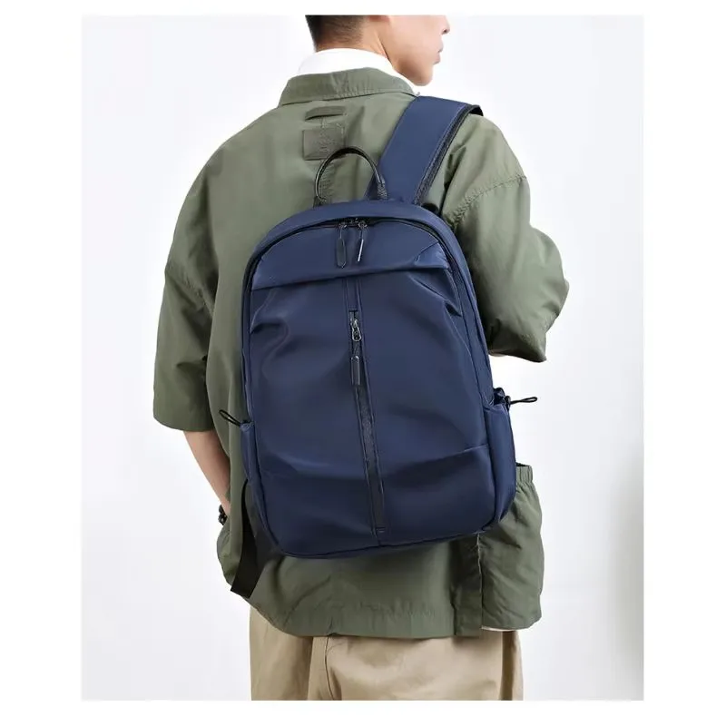 Men's water-resistant backpack with spacious compartments, perfect for laptops, travel, business, and student use