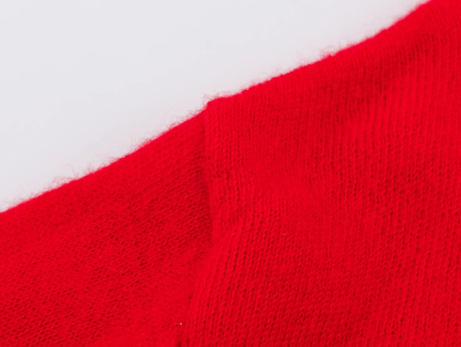YENKYE New Autumn Women Red Deep V Neck Knit Cardigan Asymmetric Button Loose Long Sleeve Casual Sweater Coat