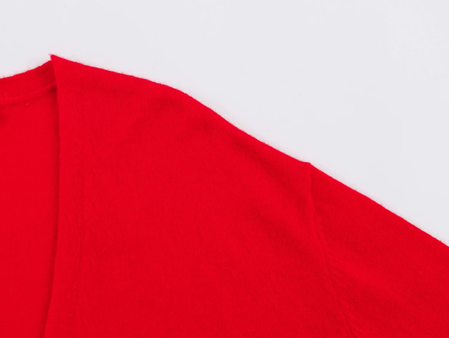 YENKYE New Autumn Women Red Deep V Neck Knit Cardigan Asymmetric Button Loose Long Sleeve Casual Sweater Coat