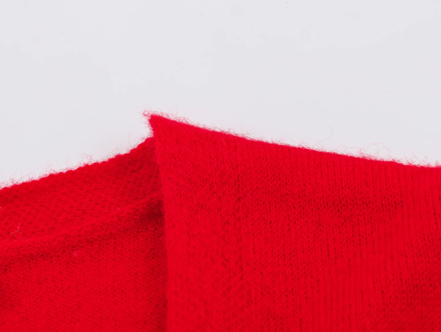 YENKYE New Autumn Women Red Deep V Neck Knit Cardigan Asymmetric Button Loose Long Sleeve Casual Sweater Coat