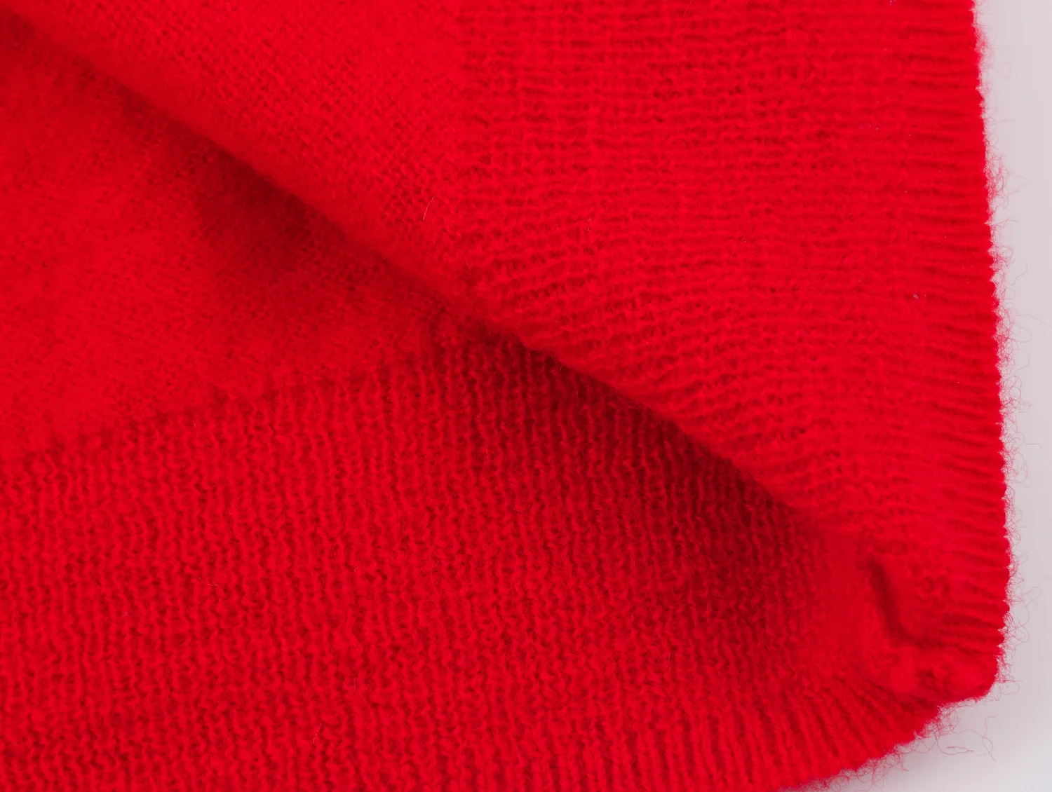YENKYE New Autumn Women Red Deep V Neck Knit Cardigan Asymmetric Button Loose Long Sleeve Casual Sweater Coat