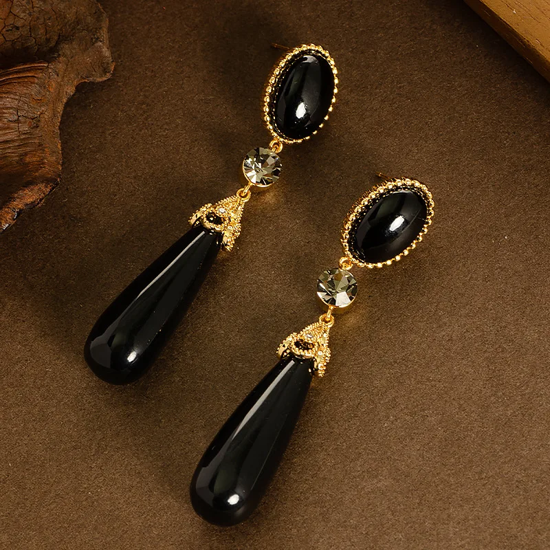 Retro style palace style long large water drop resin drop earrings light luxury high-end face slimming tassel commuter earrings