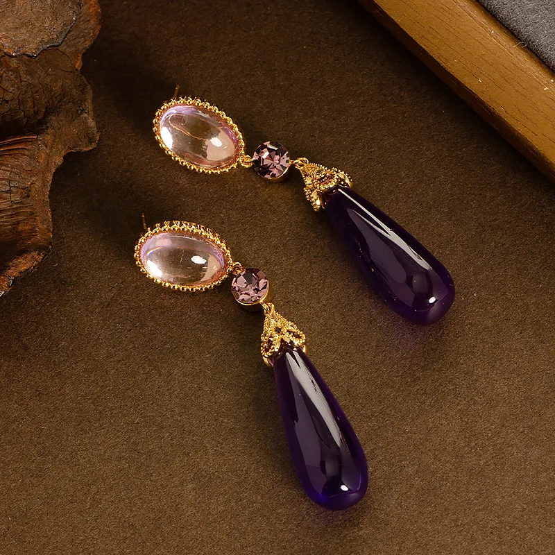 Retro style palace style long large water drop resin drop earrings light luxury high-end face slimming tassel commuter earrings