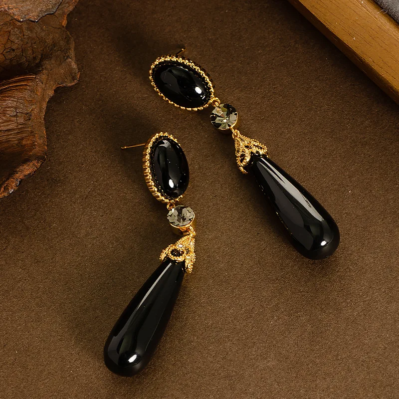 Retro style palace style long large water drop resin drop earrings light luxury high-end face slimming tassel commuter earrings