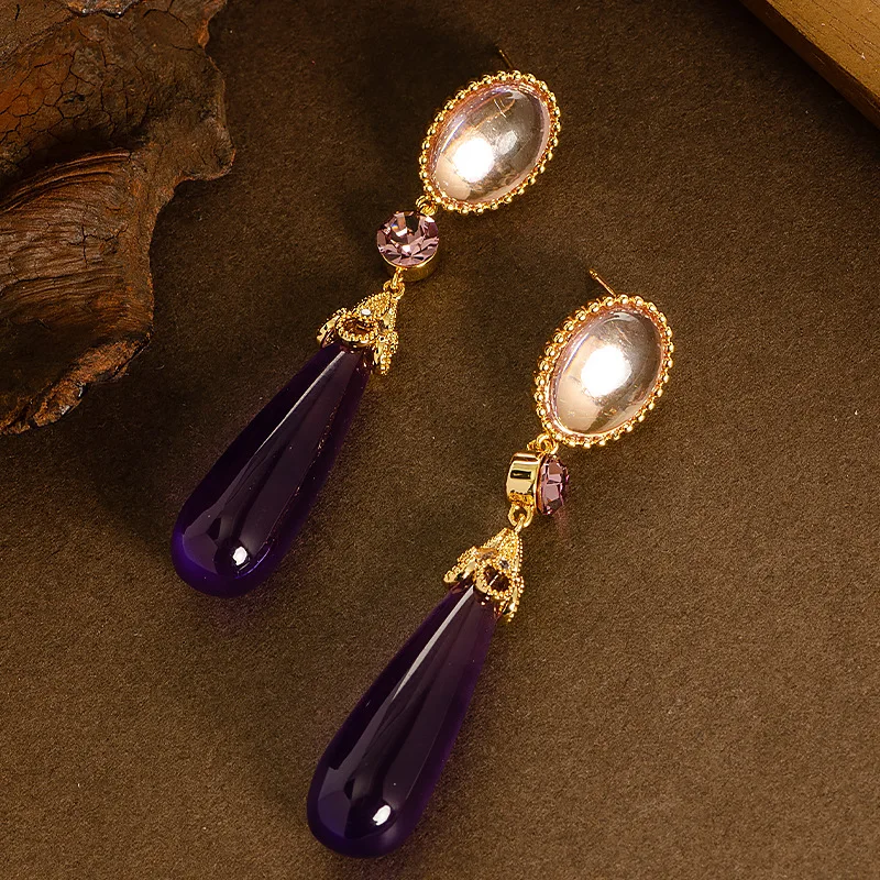 Retro style palace style long large water drop resin drop earrings light luxury high-end face slimming tassel commuter earrings