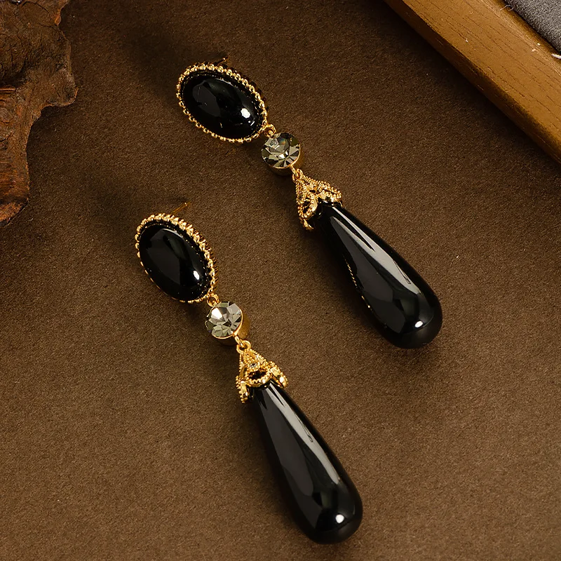 Retro style palace style long large water drop resin drop earrings light luxury high-end face slimming tassel commuter earrings