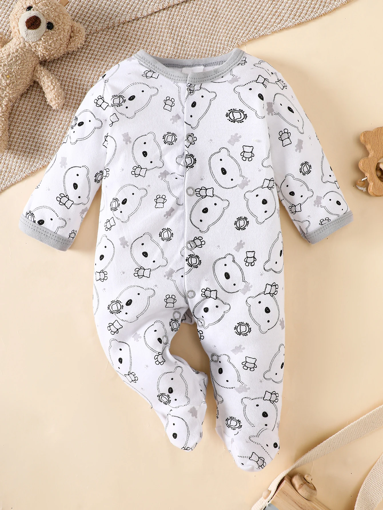 his 8-piece unisex newborn layette set fits boys and girls aged 0-9 months, with lovely grey bear prints.