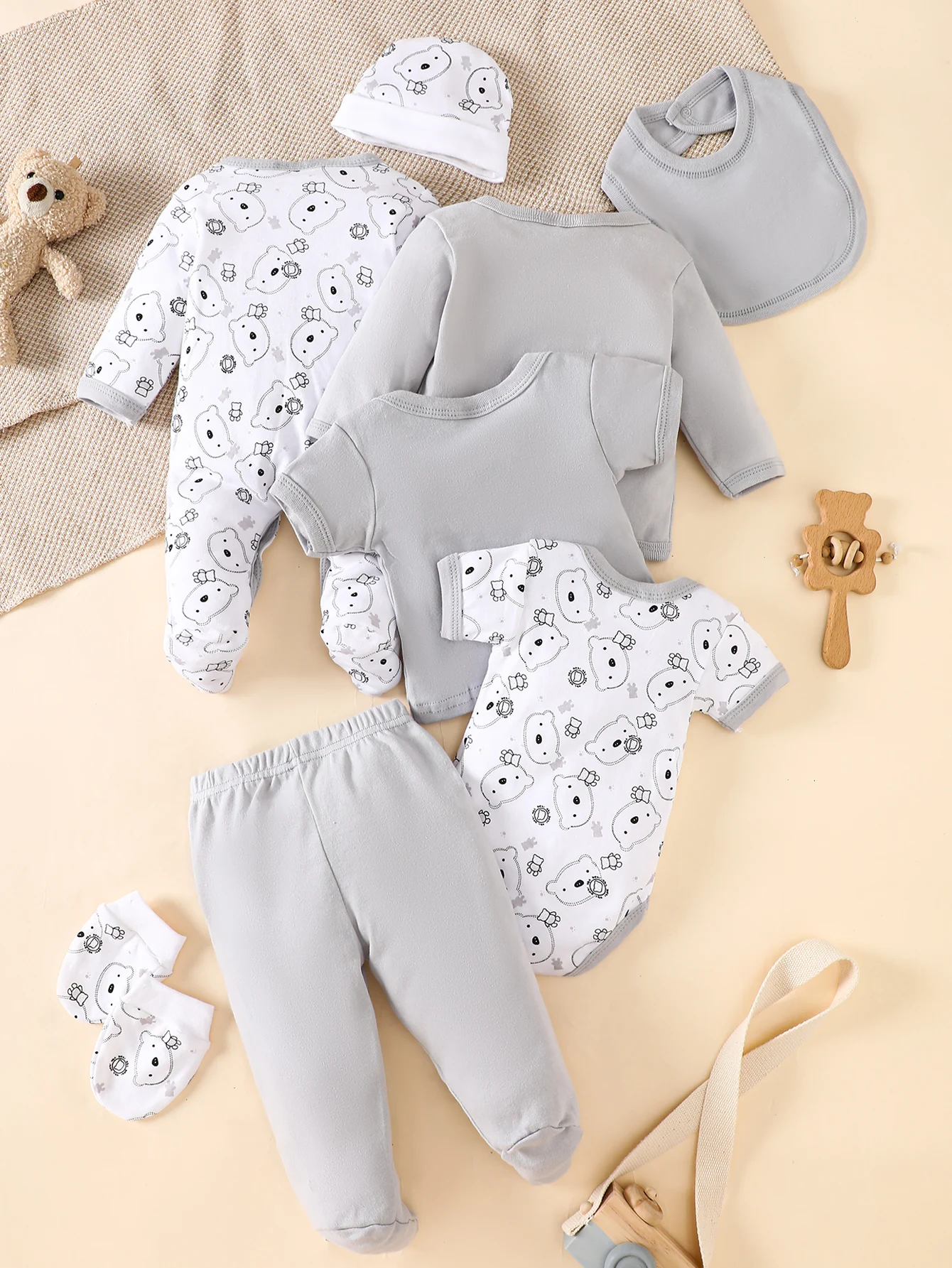 his 8-piece unisex newborn layette set fits boys and girls aged 0-9 months, with lovely grey bear prints.