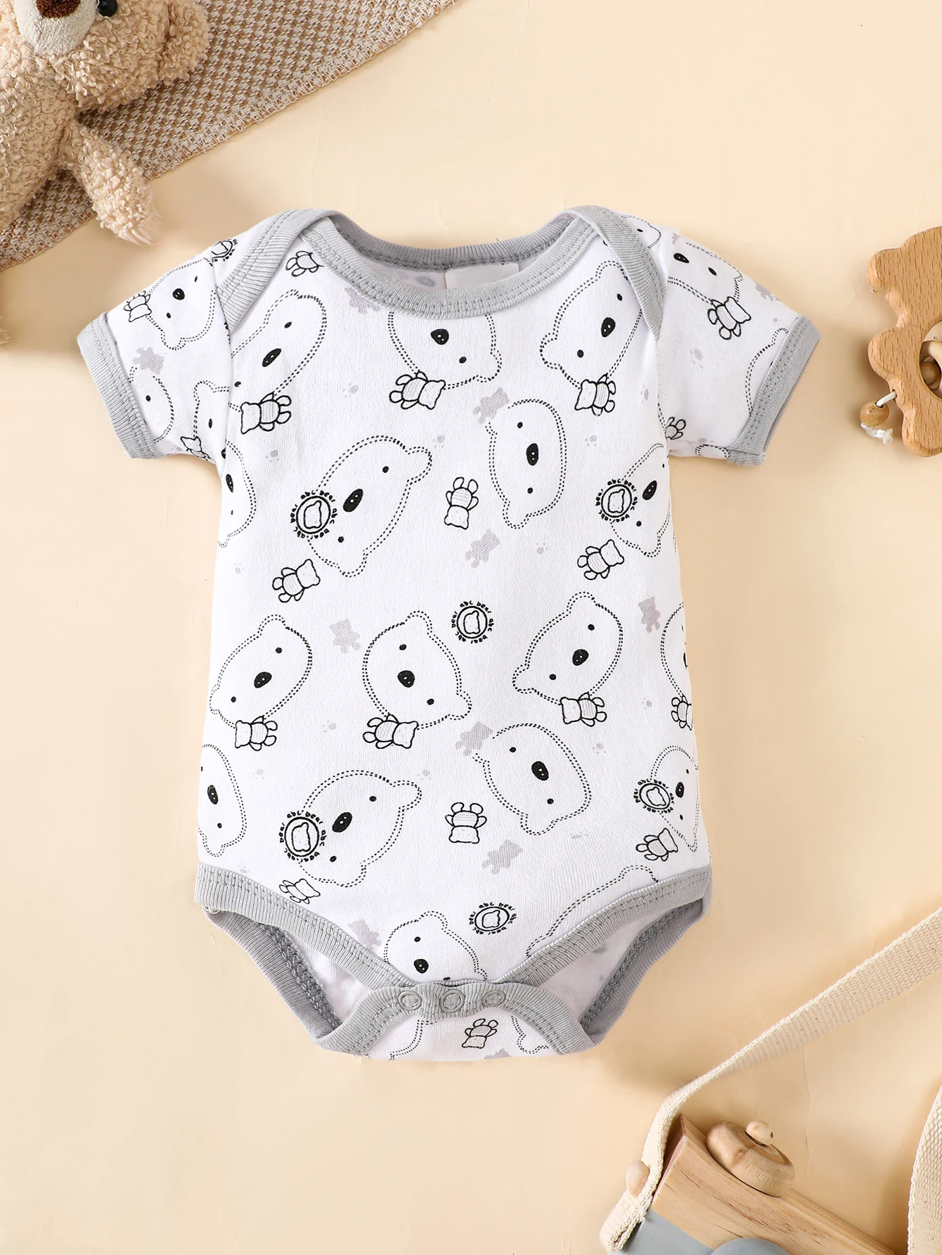 his 8-piece unisex newborn layette set fits boys and girls aged 0-9 months, with lovely grey bear prints.