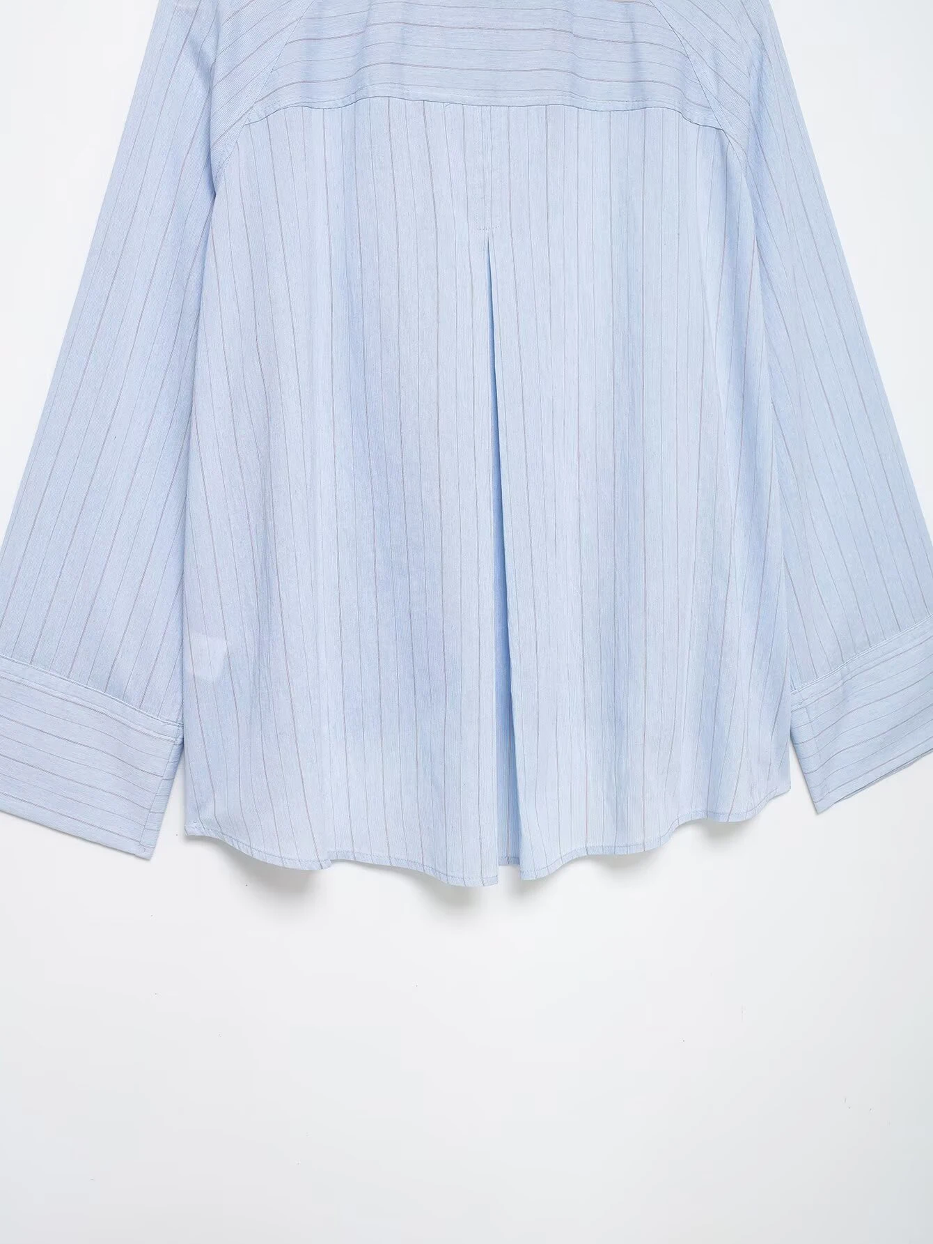 Spring and summer new women's clothing French round neck long sleeved asymmetrical hem flip chest pocket striped shirt