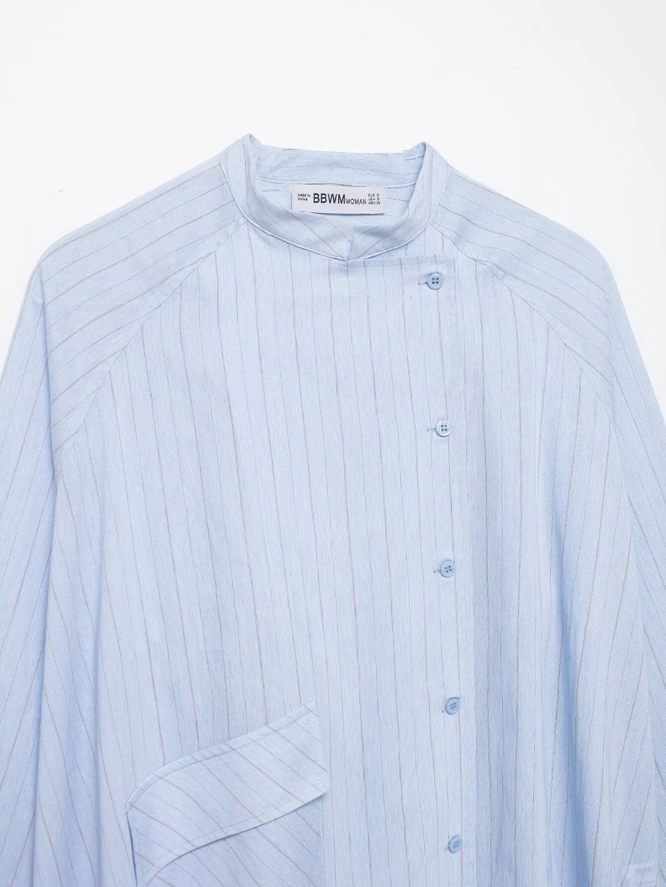Spring and summer new women's clothing French round neck long sleeved asymmetrical hem flip chest pocket striped shirt