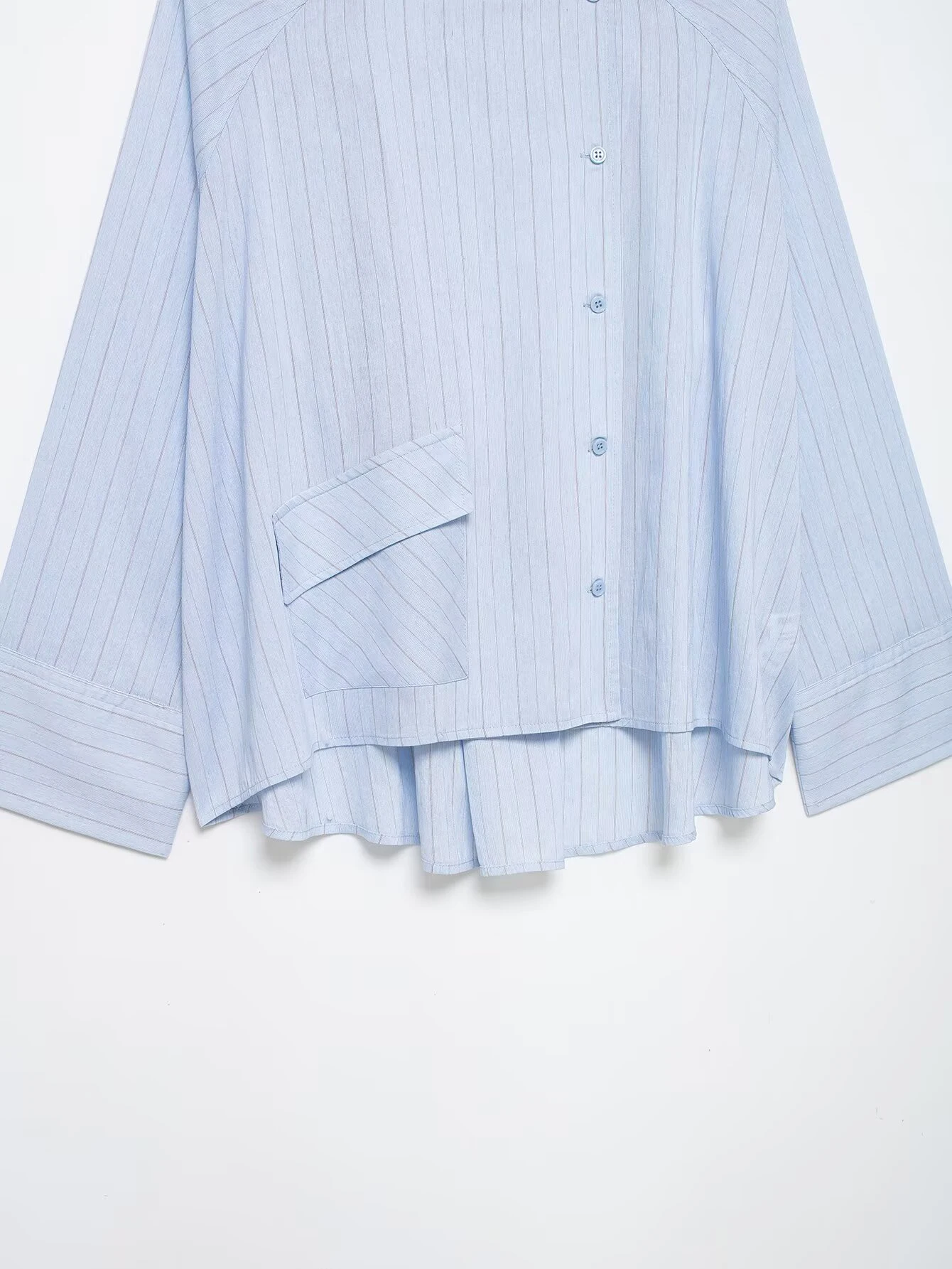 Spring and summer new women's clothing French round neck long sleeved asymmetrical hem flip chest pocket striped shirt