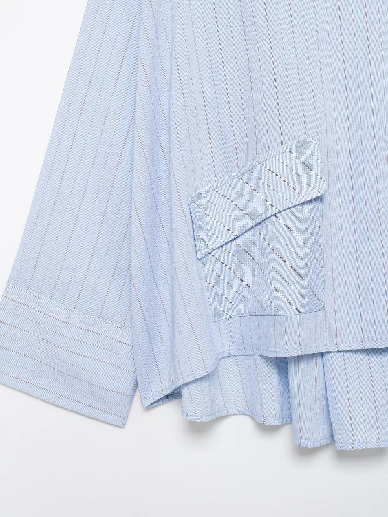 Spring and summer new women's clothing French round neck long sleeved asymmetrical hem flip chest pocket striped shirt