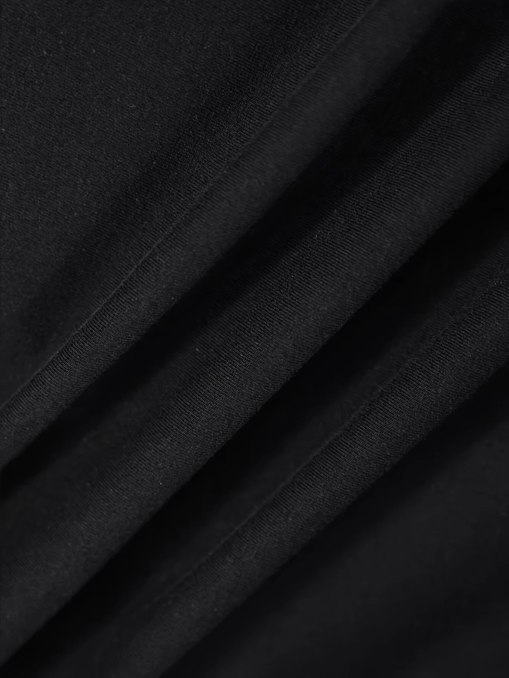 The black T-shirt features a red and white Cybernet system graphic with a triangular design and the word "SKYNET DIVISION" on it