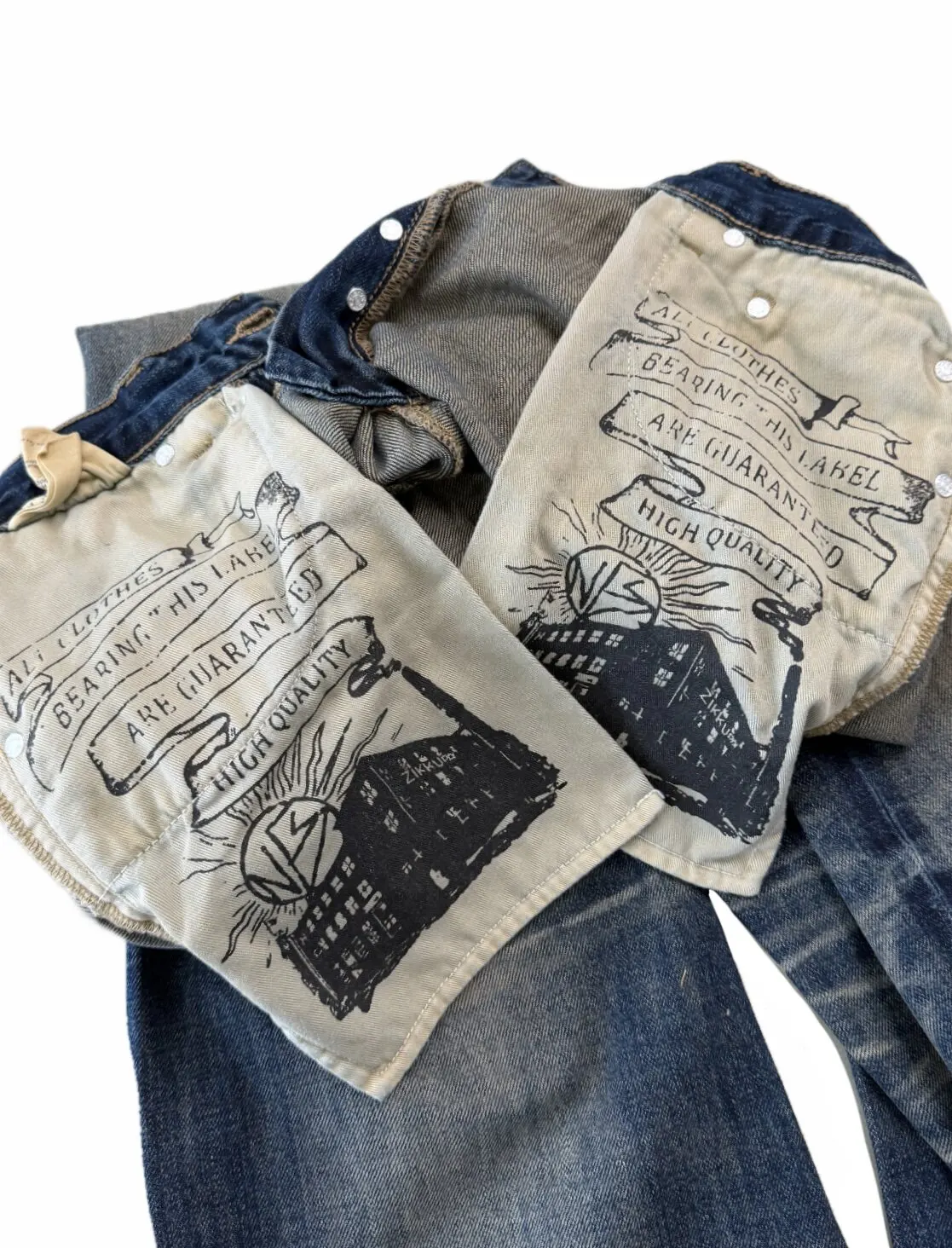 Button‑Fly Cat‑Whisker Pleated Indigo Selvedge Bootcut Jeans