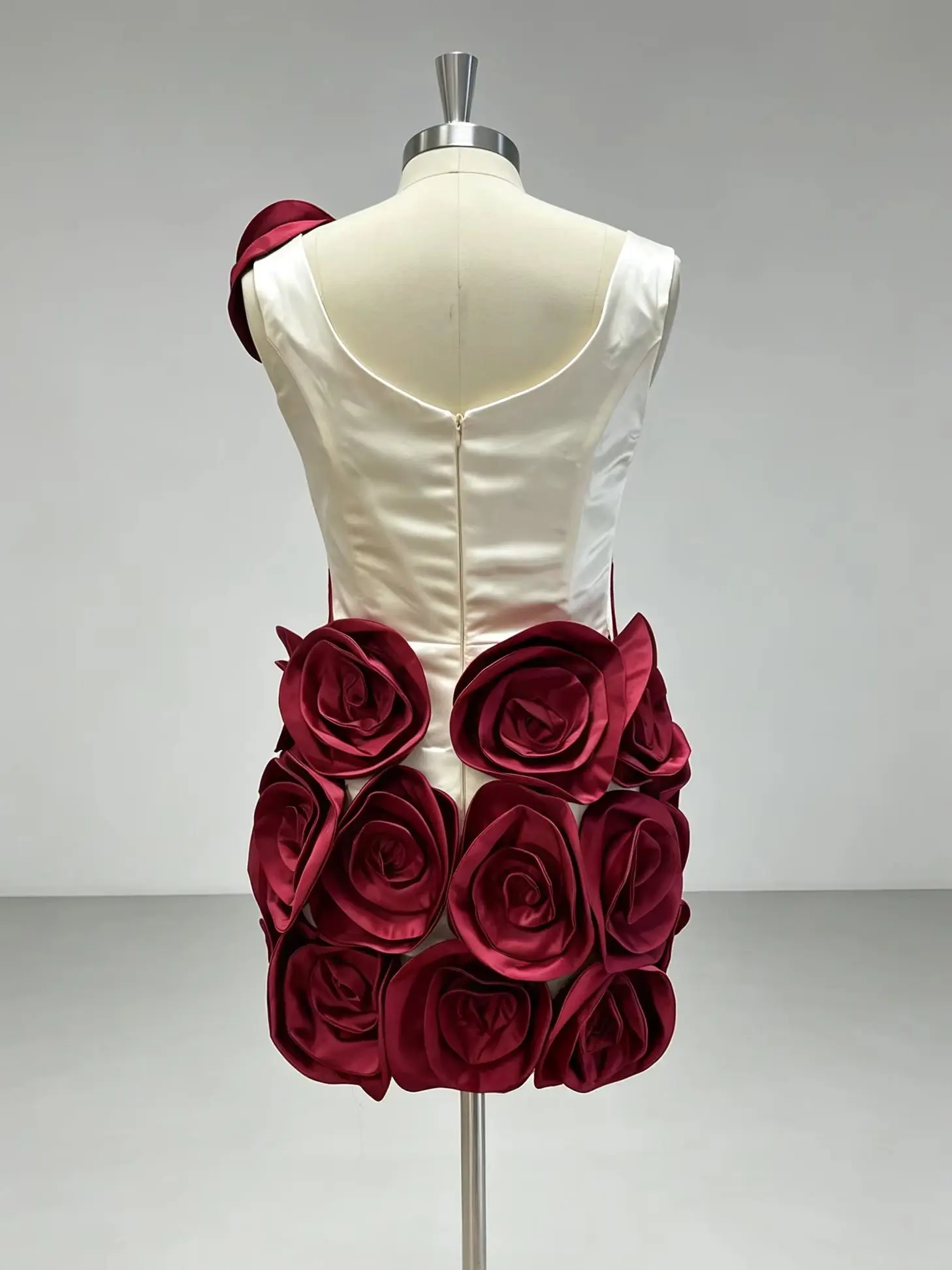 Elegant Ivory Dress With Red Embellishments And Large Rose Accents On Skirt And Shoulder Exudes Glamour And Sophistication Perfe