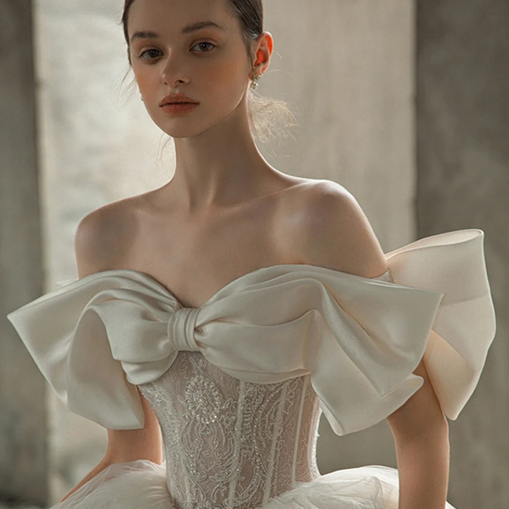Off The Shoulder Sweetheart Neck Shiny Beading Pearls Bow Tulle Lace Bow Ball Gown Wedding Dresses With 100cm Chapel Train