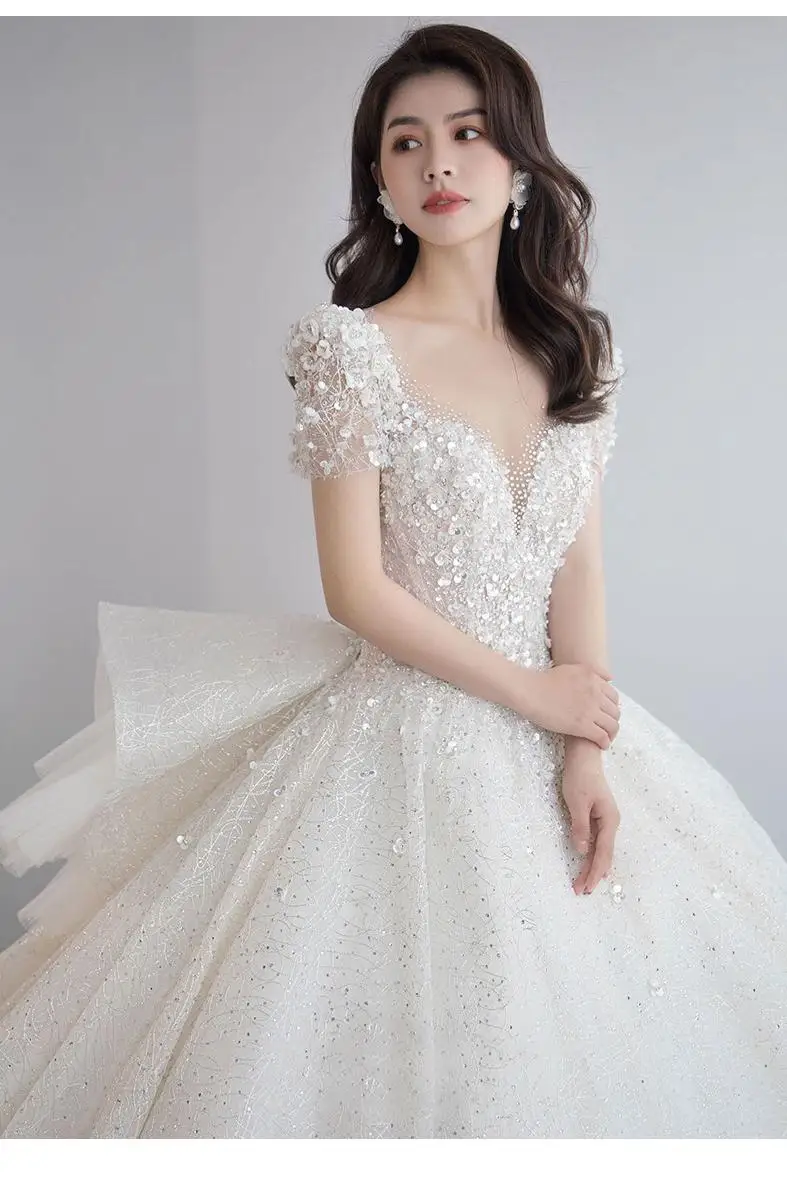 Luxury Short Sleeve Wedding Dress 2026 New Bridal Dress V Neck Beading Shinning Ball Gown Sweep Train Vestido Noiva Customized