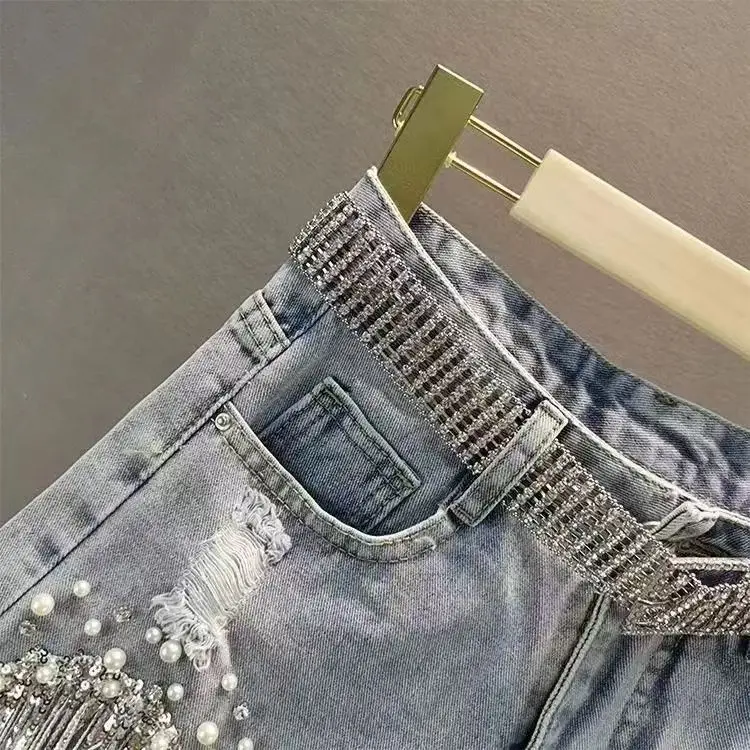 Women High-Waisted Rhinestone Pearl Fringe Denim Shorts Light Wash Distressed Design with Sparkly Tassel Trim Shorts
