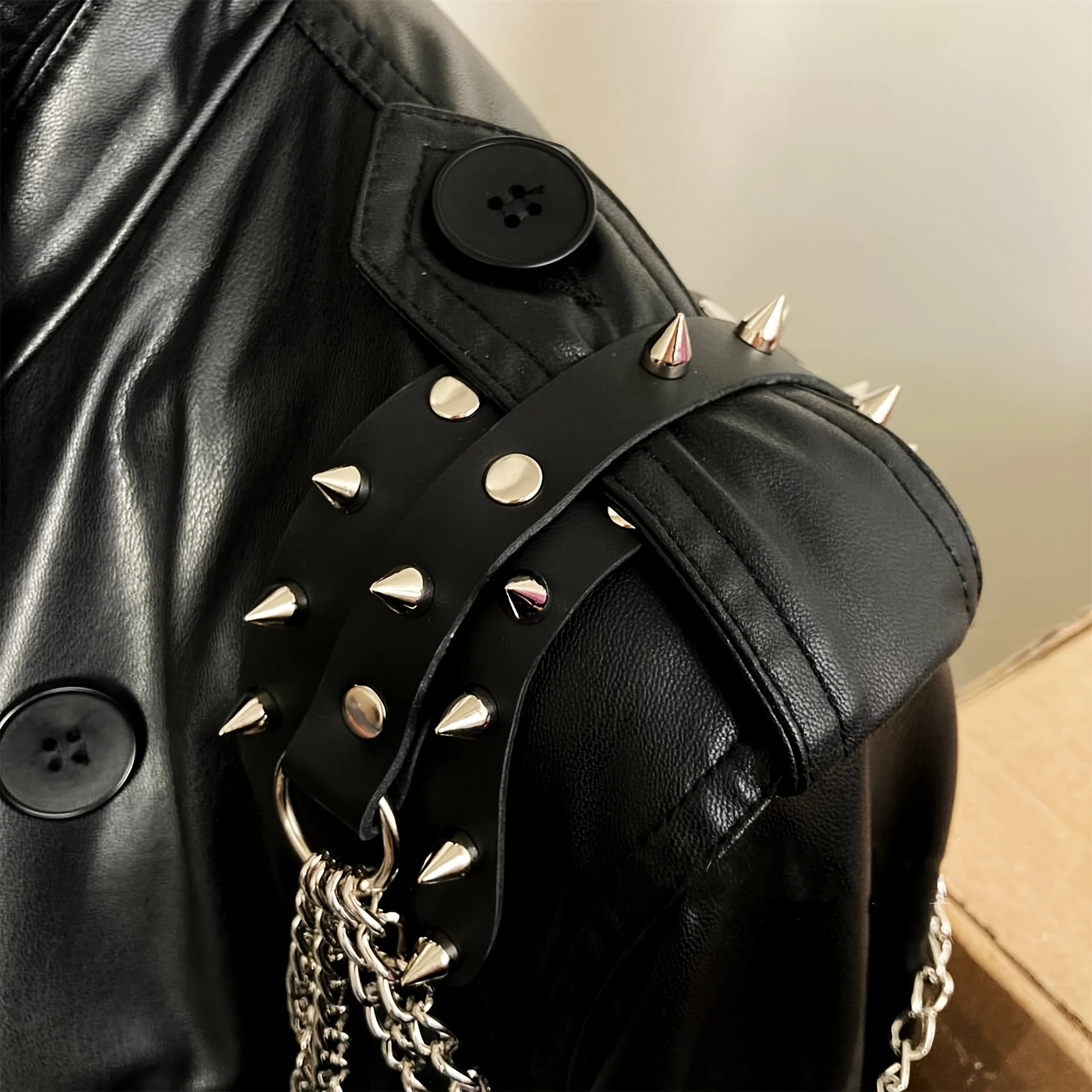 UYEE unisex synthetic leather shoulder armor with rivet details and chain tassel fashionable black studded waistband accessory
