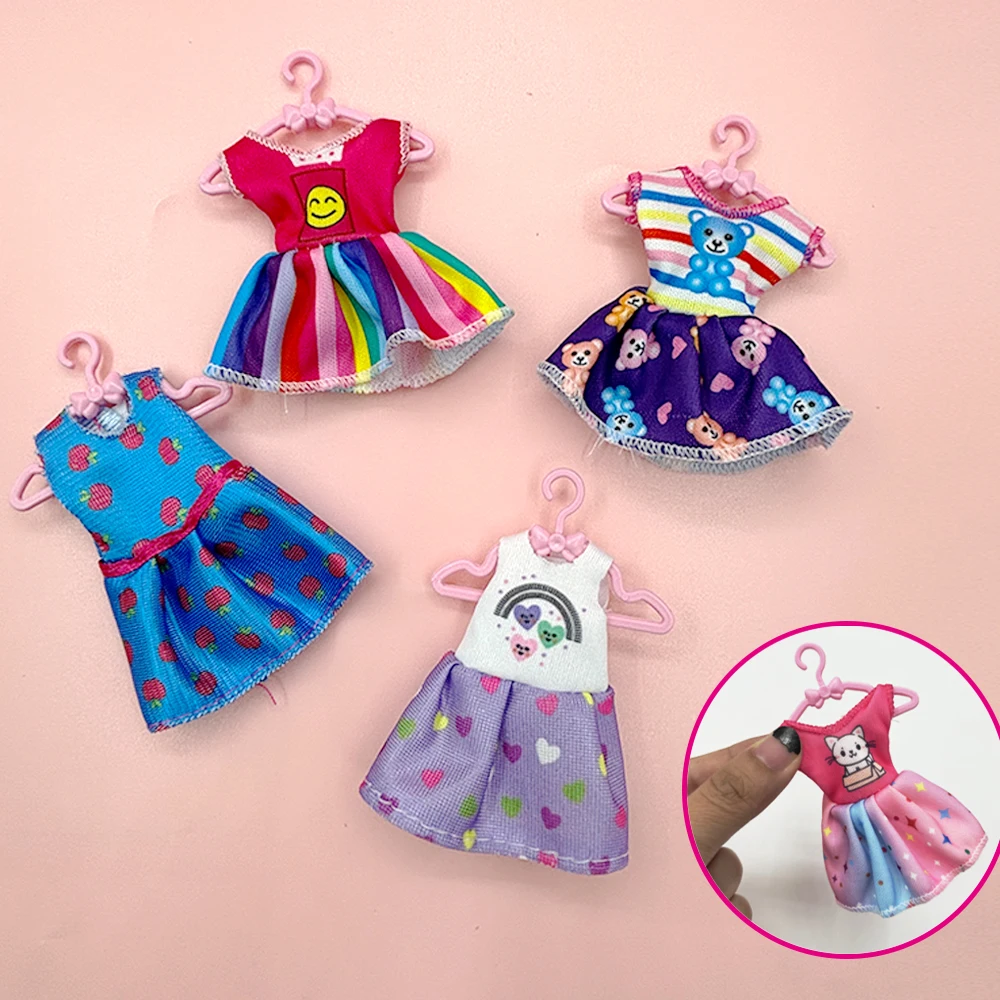 22pcs Set of 5.5-Inch Cute Doll Clothes and Accessories, 8pcs Skirt, 10 Hangers, 4pcs Mini Computer Headset Accessories Set
